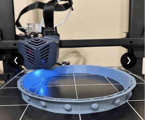 3D printer printing the crown's circular base ring.