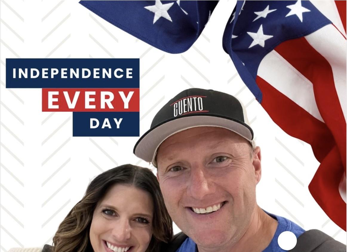 Wayne, wearing a CUENTO cap, and his co-founder Katie smiling together in a selfie, with an American flag and 'Independence Every Day' text graphic overlay.