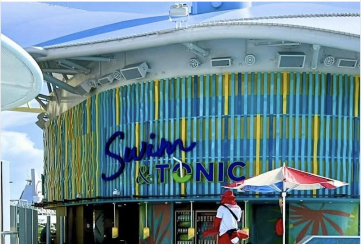 The colorful 'Swim & Tonic' bar area aboard a Royal Caribbean cruise ship